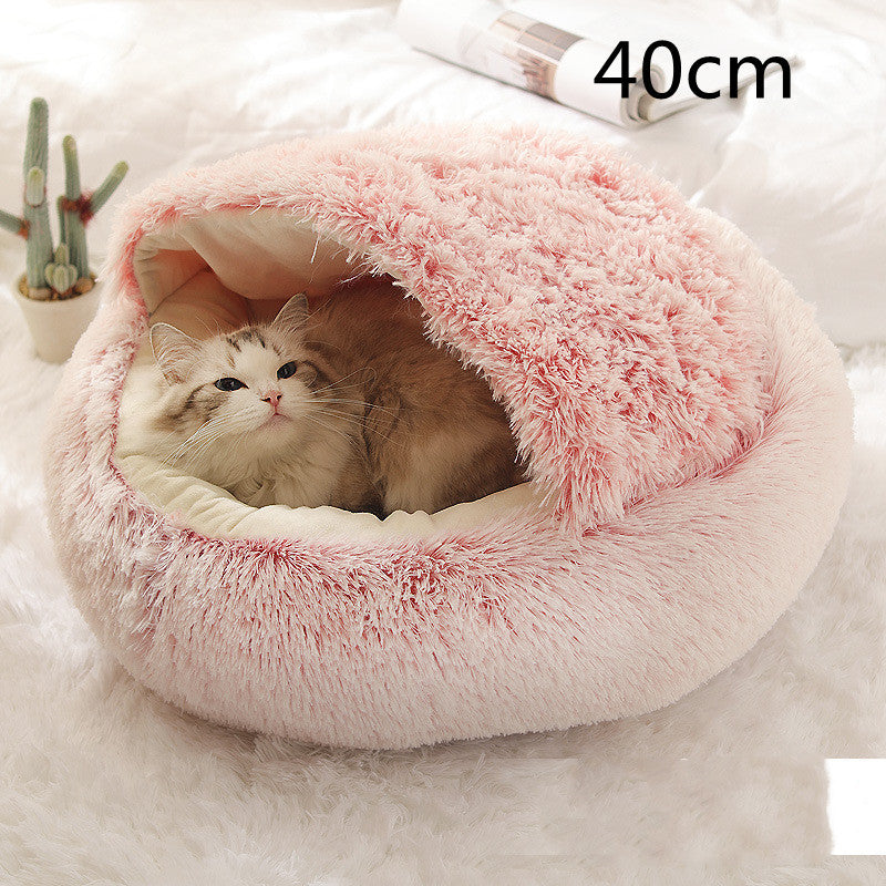 Small dog and kitten snuggled in a round pink 40 cm plush Cozy Cat Dog Bed showcasing warmth, comfort, and cozy design with soft material and raised edges