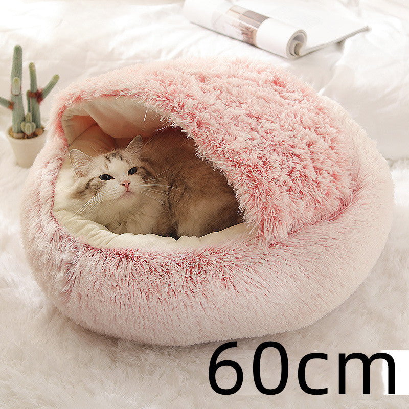 Small dog and kitten snuggled in a round pink 60 cm plush Cozy Cat Dog Bed showcasing warmth, comfort, and cozy design with soft material and raised edges