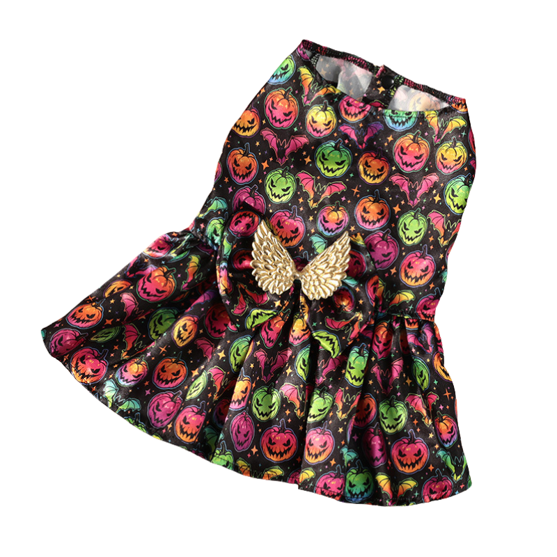 Dress with Halloween-themed pattern and gold angel wings on a white background