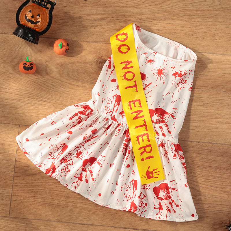 Halloween-themed dress with 'Do Not Enter!' sash on a wooden surface