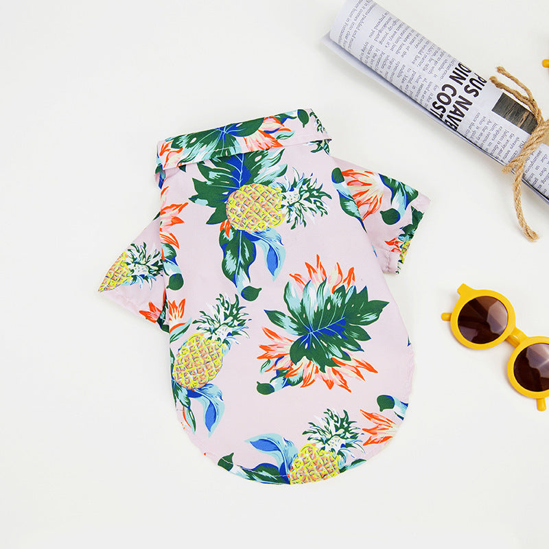 Pink pineapple Hawaiian pet shirt for dogs and cats, featuring a tropical design, ideal for summer and providing comfort for your pet.
