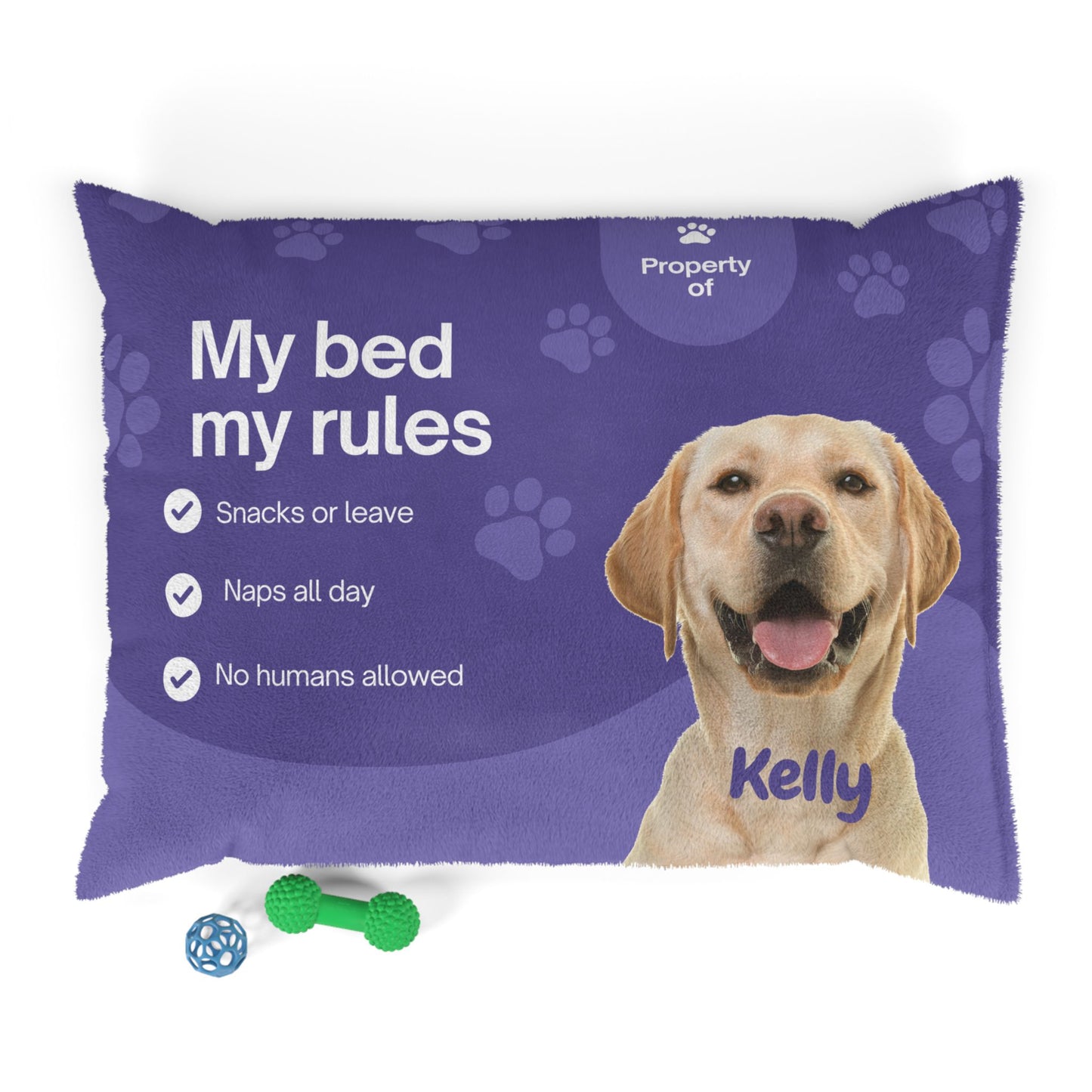 Dog bed with a purple cover featuring a Labrador Retriever named Kelly and text about dog rules.