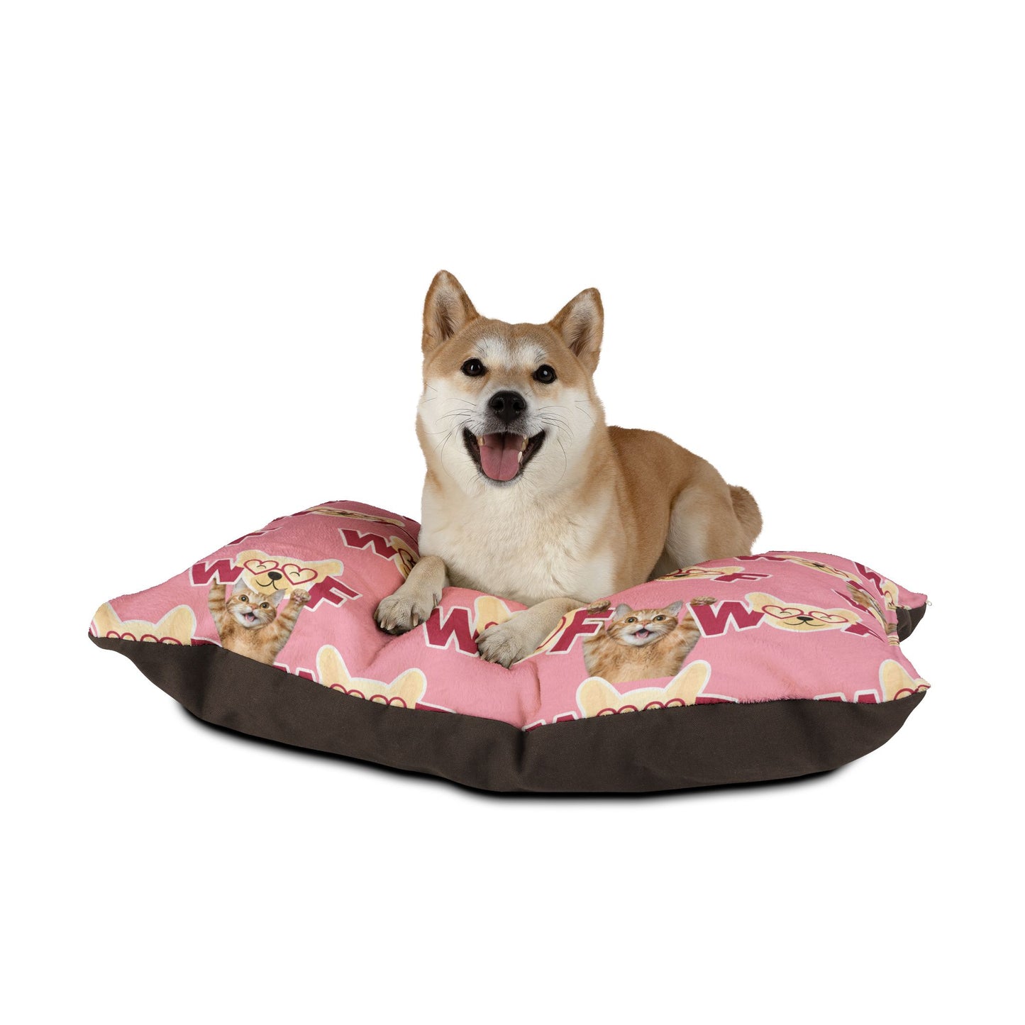 Dog sitting on a pink and brown pet bed with cartoon characters on a white background