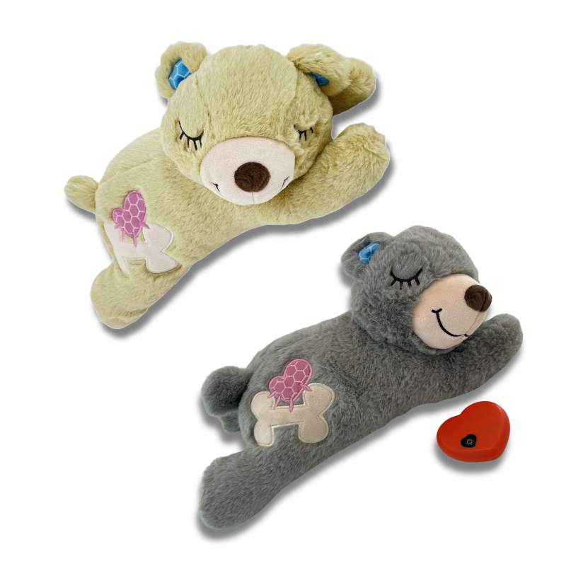 Two plush toys, one green and one gray, on a white background