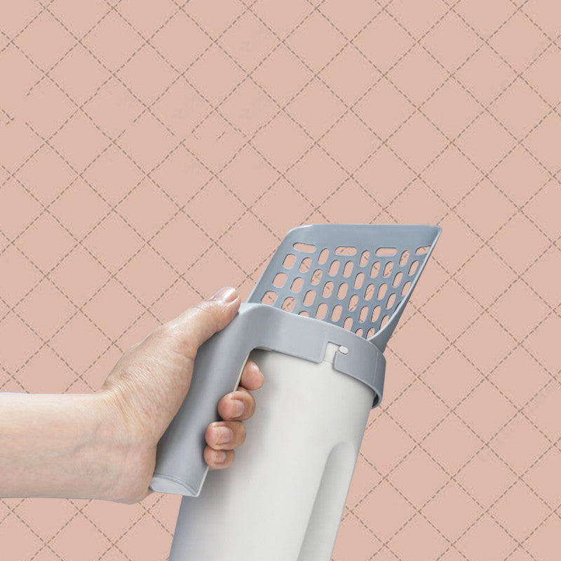 Cat Litter Scooper with Storage Box and a cat next to it close up
