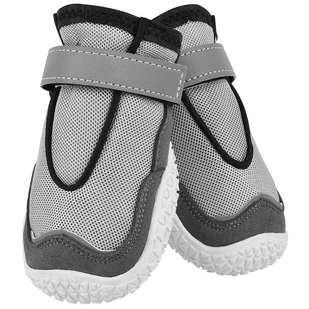 breathable dog boots and wear-resistant grey dog shoes protecting paws in outdoor conditions close up other