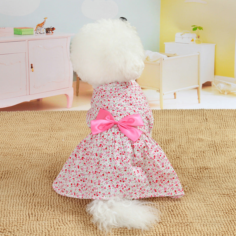 Back view of a dog wearing a red floral princess dress with a bowknot. Stylish, breathable, and perfect for special occasions