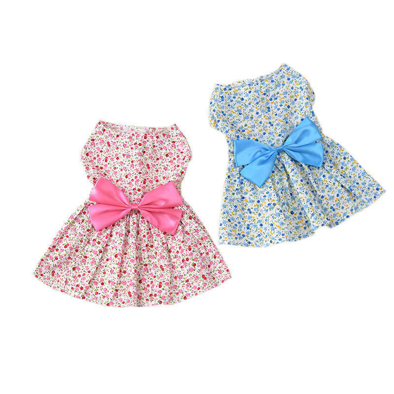 Red and blue princess dog dresses displayed flat, showcasing their floral design, bowknots, and breathable cotton fabric white background