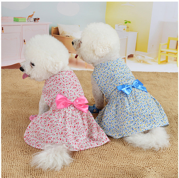 Two dogs wearing princess dresses, one in red and one in blue, featuring floral patterns and bowknots. Perfect for special occasions and everyday elegance back side