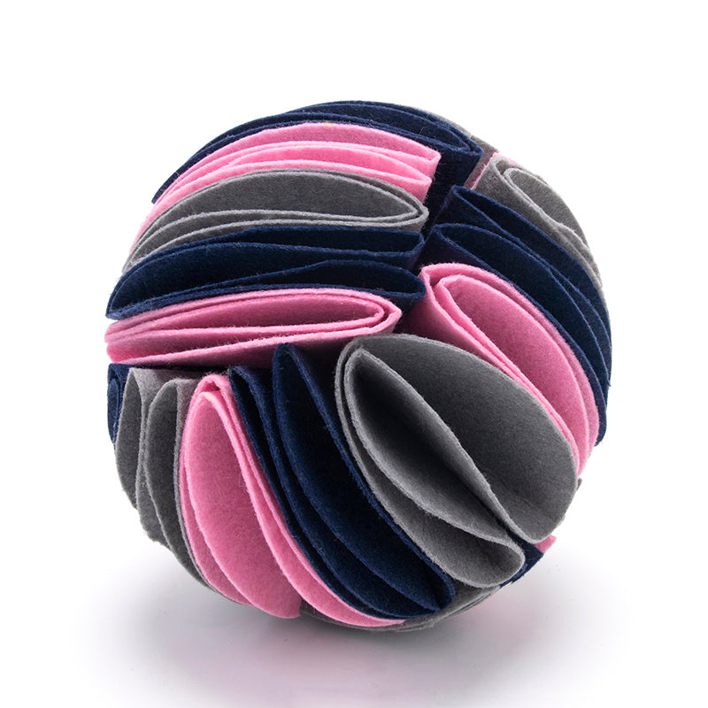 Dog playing with foldable Snuffle Ball for Dogs IQ toy for slow feeding and mental stimulation gray variant