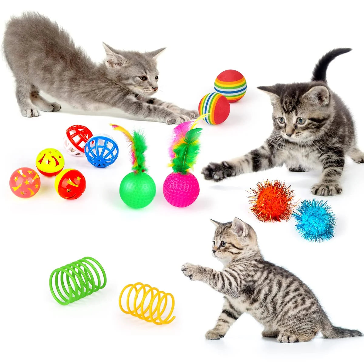Three cats playing with various colorful cat toys on a white background