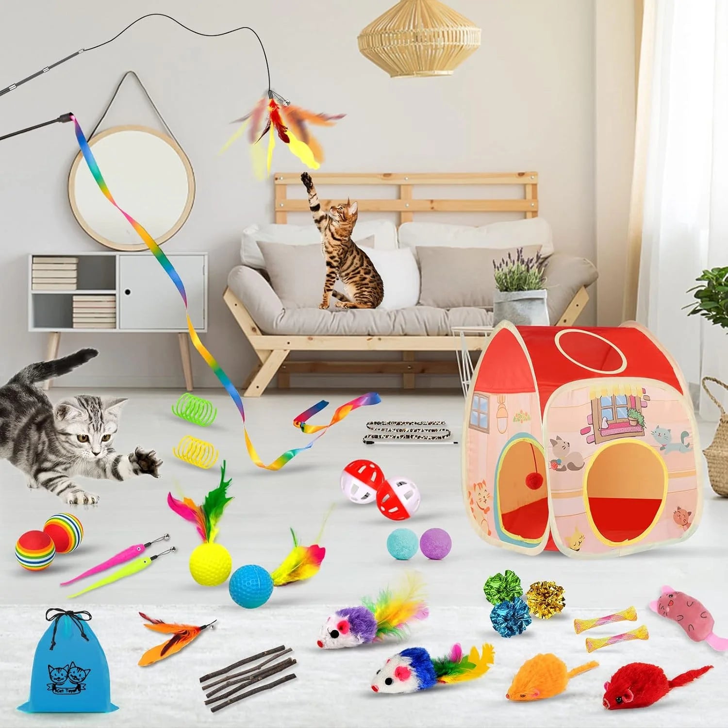 Cat toys and a playhouse on a white floor with a cat sitting on a couch.