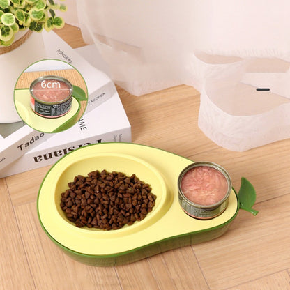 Cat Feeder Bowl shaped like an avocado with dry food and a can on a wooden surface.