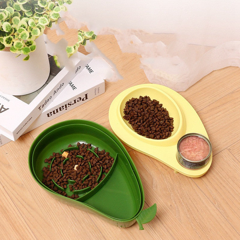 Two Cat Feeder Bowl with food on a wooden surface, one green and one yellow, with a can of food nearby.