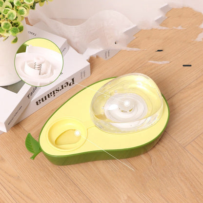 Avocado-shaped Cat Feeder Bowl on a wooden surface with a small inset showing a close-up of the interior.