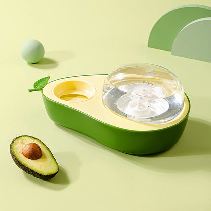 Avocado-shaped Cat Feeder Bowl with a clear water dish on a light green background