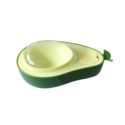 Avocado-shaped Cat Feeder Bowl with a green shell and yellow interior on a white background