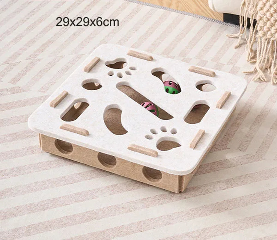 White and brown cat puzzle toy on a striped surface