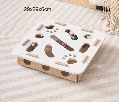 White and brown cat puzzle toy on a striped surface