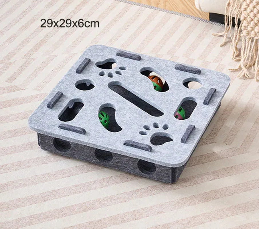 Gray foam block with various holes and cutouts on a striped fabric background