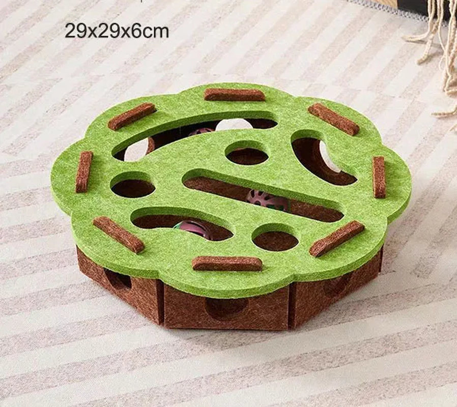 Green and brown pet toy on a striped fabric background
