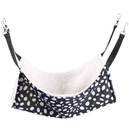 Pet hammock with black and white polka dot pattern on a white background