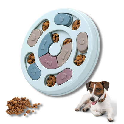 Pet puzzle toy with food compartments and a dog sitting next to it on a white background