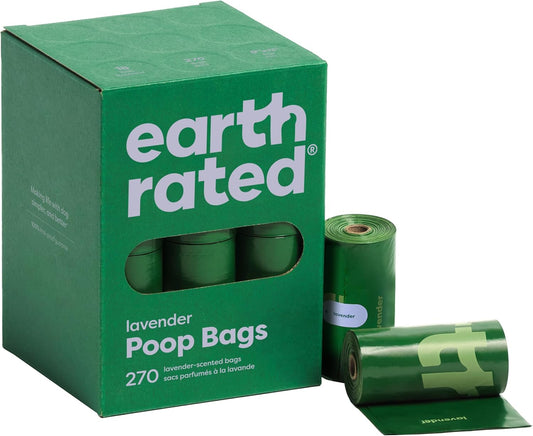 Green box of earth rated lavender poop bags with a roll on a white background