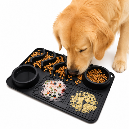 Dog eating from a black Dog Silicone Licking Pad & Slow Feeder Bowl on a white background