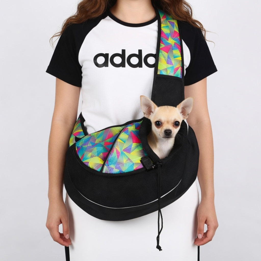 Person wearing a colorful Dog Sling Carrier Bag with a small dog inside, on a plain background