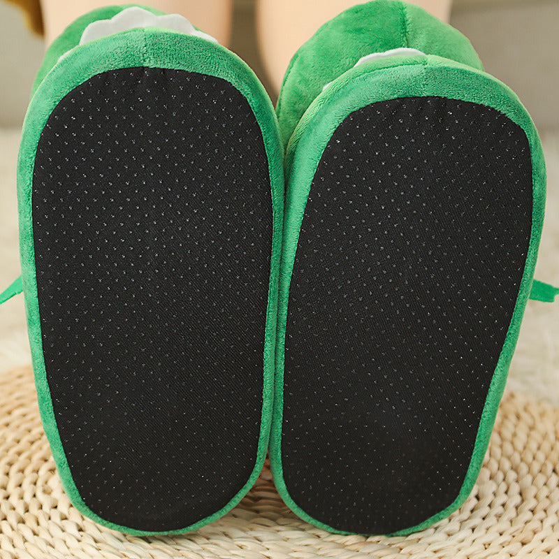 Green Funny Plush Slippers for Pet Owners with black soles on a woven surface