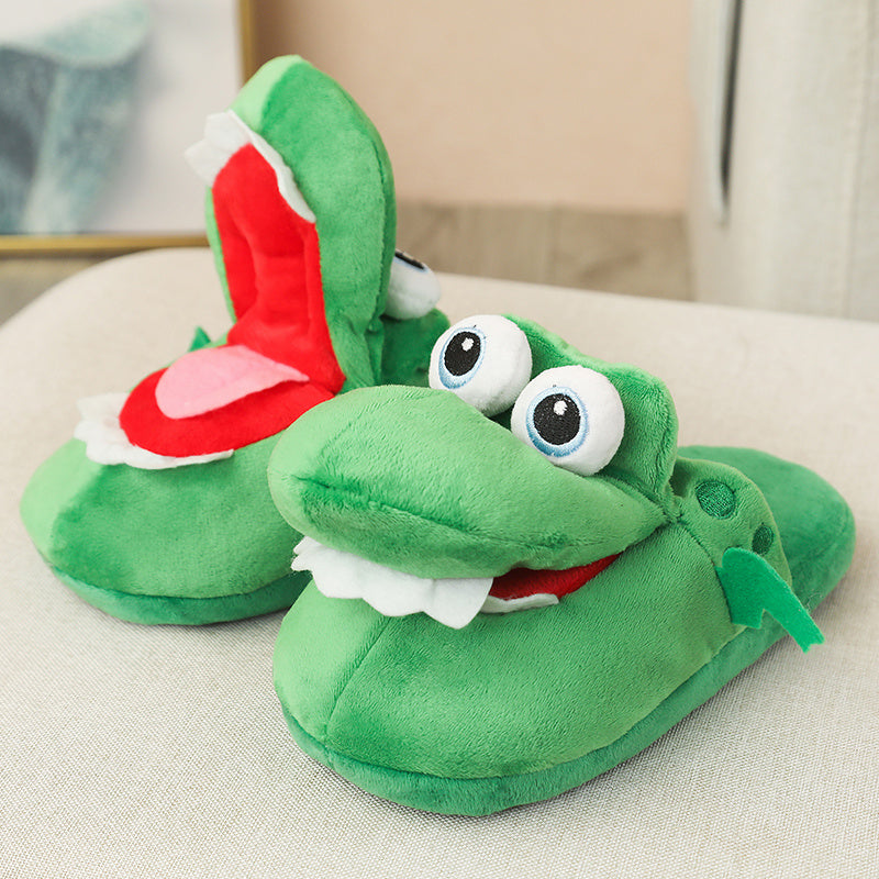 Green Funny Plush Slippers for Pet Owners shaped like a cartoon character with a red tongue on a light surface.