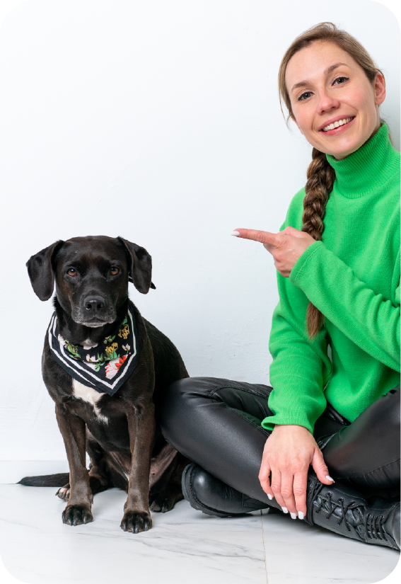 a woman with her black dog