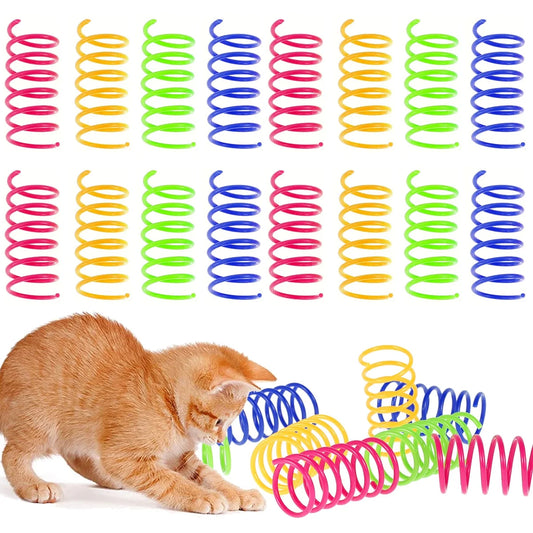Colorful spring toys for cats with a cat playing with them on a white background