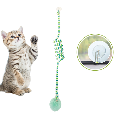 Cat playing with a striped Interactive Cat Hanging Toy with a ball at the bottom, on a white background.