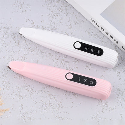 Two LED Pet Hair Clippers, one pink and one white, on a light gray surface with a book in the background.