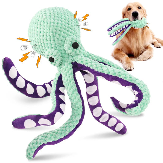 Green and purple octopus-shaped dog toy with a dog chewing on it.