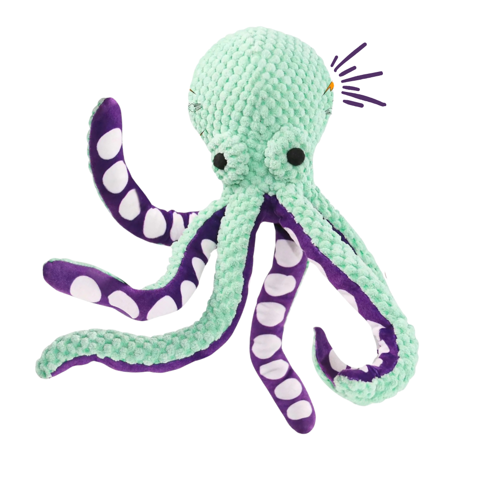 Crocheted octopus toy with purple and white accents on a white background