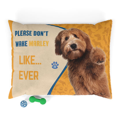 Pillow with a dog's face and text 'Please don't wake Marley like... ever' on a white background