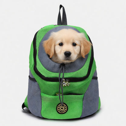 Green and gray pet carrier with a puppy peeking out on a white background