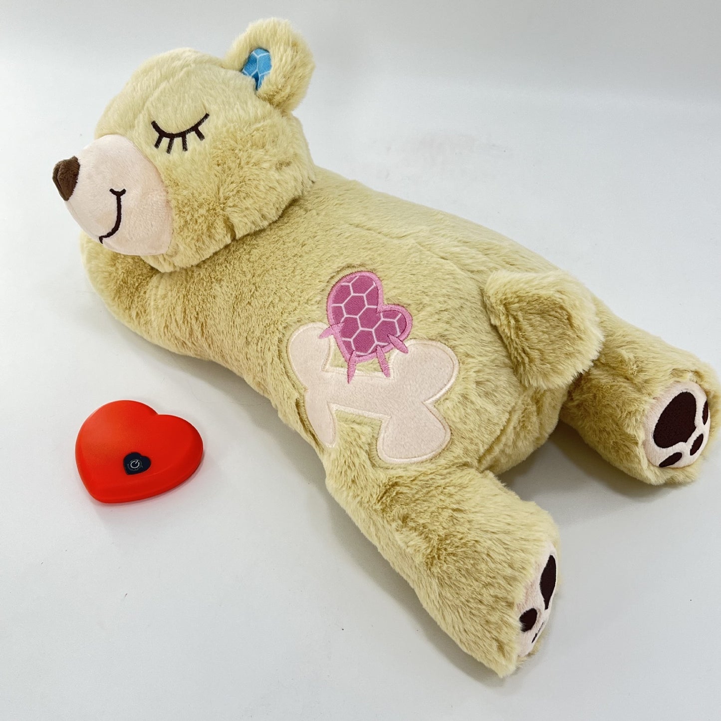 Plush toy bear with turtle design on a white background