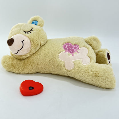 Plush toy bear with a heart-shaped patch on a white background