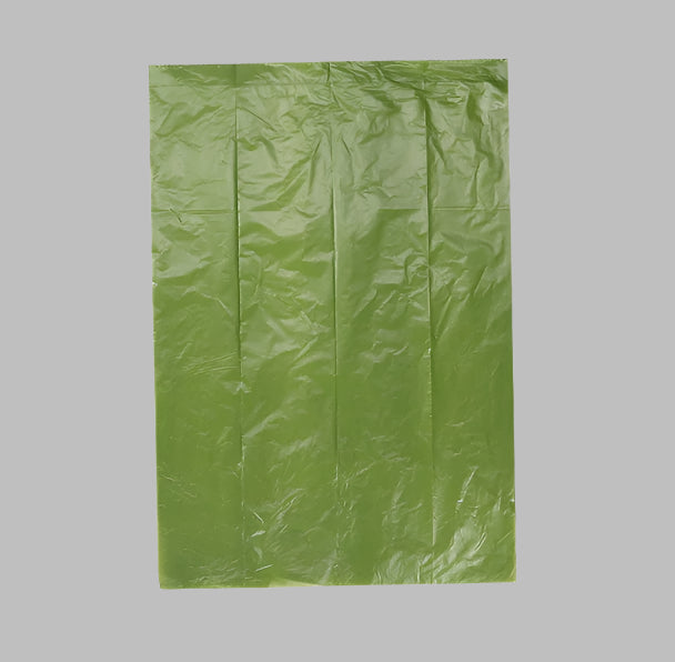 Close-up view of a biodegradable pet waste bag, showcasing its thickness, smooth touch, and durability