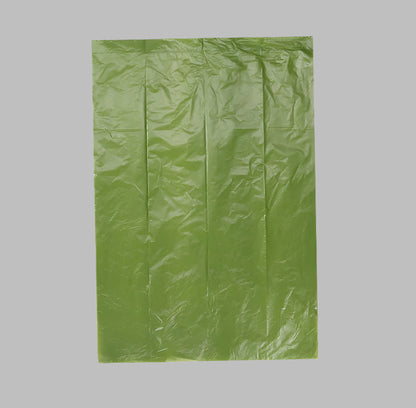 Close-up view of a biodegradable pet waste bag, showcasing its thickness, smooth touch, and durability