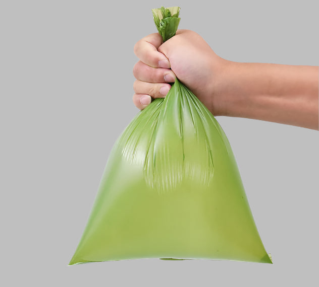 Showing a filled biodegradable pet waste bag, ready for disposal, showcasing its durability and leak-proof design