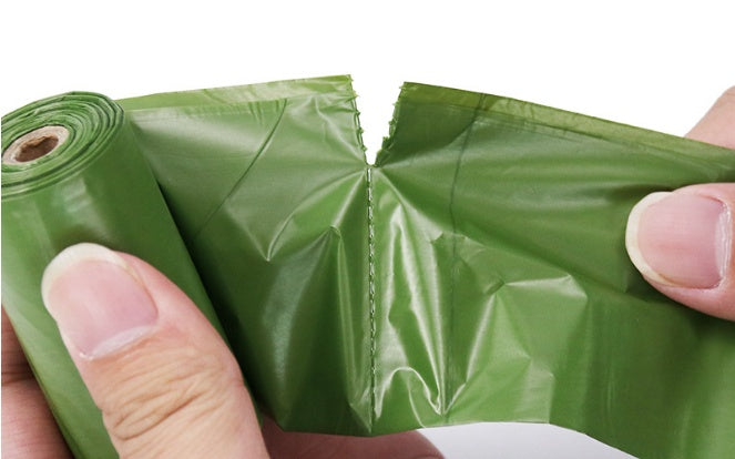 Demonstrating how the biodegradable pet waste bags easily separate from the roll for quick use