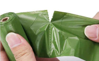 Demonstrating how the biodegradable pet waste bags easily separate from the roll for quick use