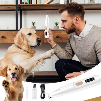 Man with two dogs interacting with a pet grooming tool on a wooden shelf background
