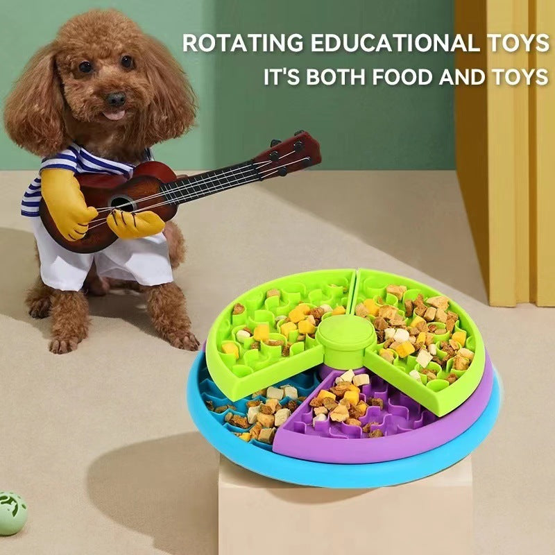 Dog playing with a rotating educational toy that combines food and play elements.