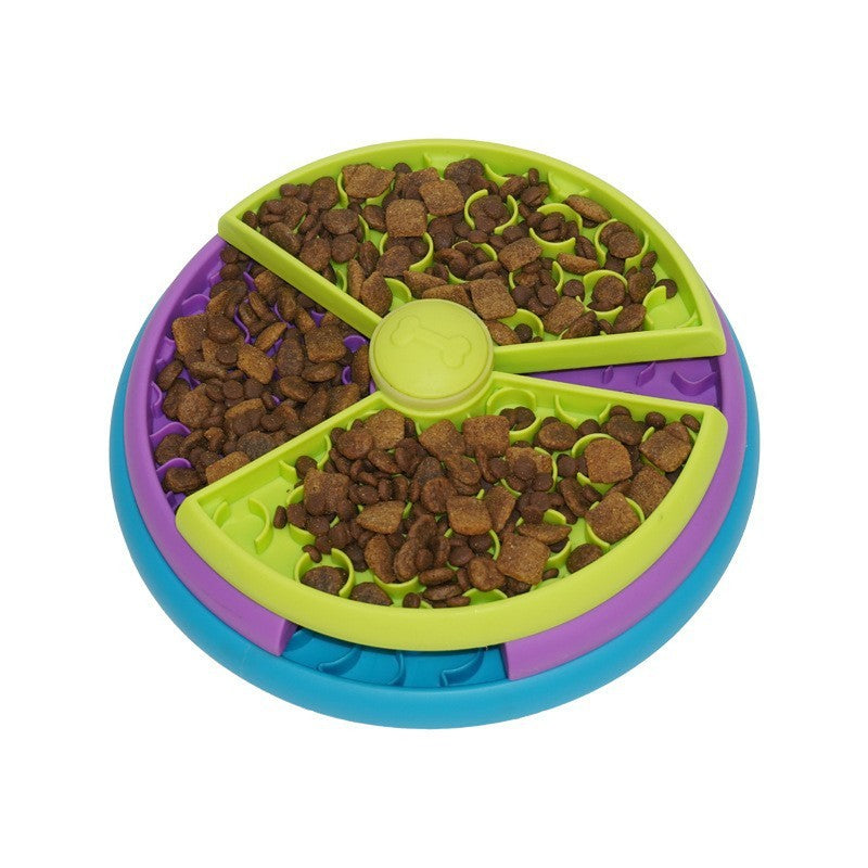 Colorful pet toy with compartments filled with dog food on a white background